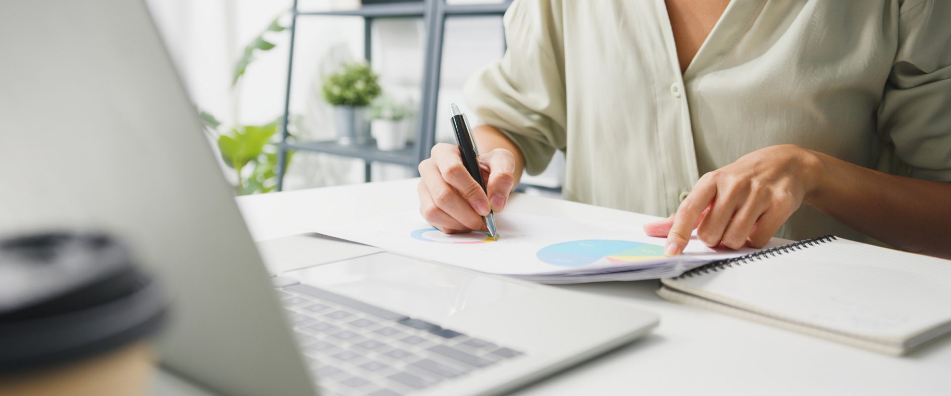 Freelance young Asia businesswoman casual wear using laptop work Freelance young Asia businesswoman casual wear using laptop working in living room at home. Working from home, remotely work, self isolation, social distancing, quarantine for corona virus prevention.